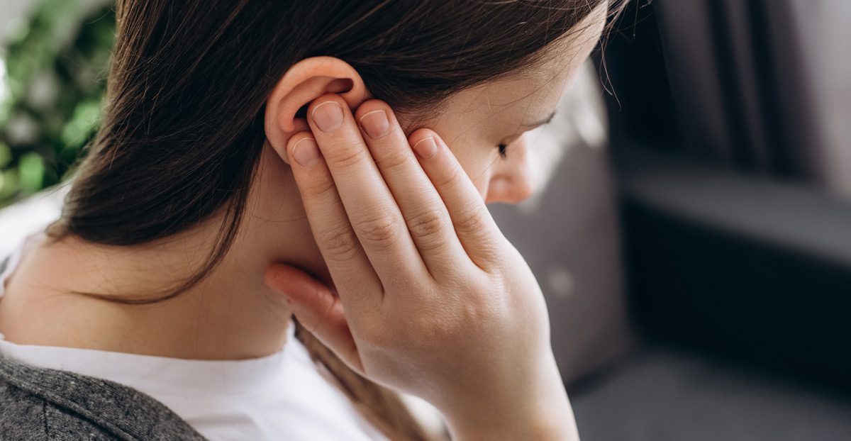 Woman-holding-ear-due-to-pain
